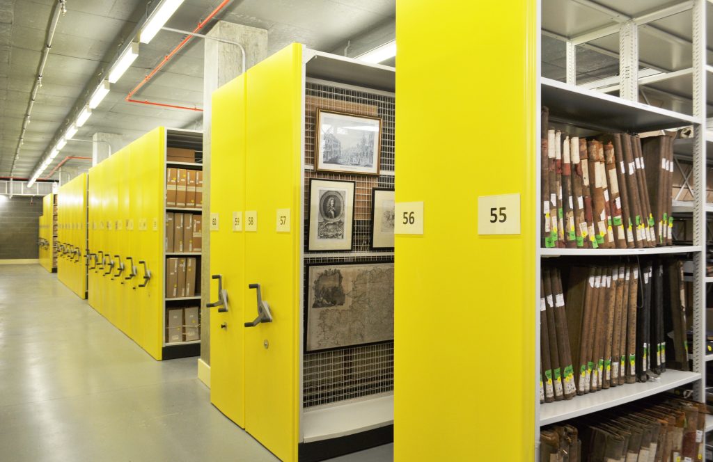 Image shows bright yellow storage stacks at PRONI in Northern Ireland. Image courtesy of Bruynzeel